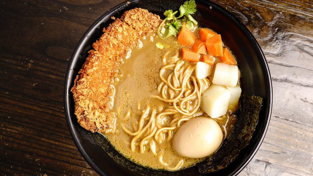 Curry Ramen · Panko breaded and deep-fried, served in flavorsome Japanese curry broth with potatoes, carrots, aonori, nori, and ajitama