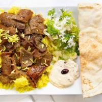 Gyros · Lamb and beef mixture and roasted with rice, salad, tzatziki sauce, and pita bread.