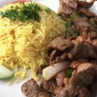 Lamb Shawarma · Lamb sautéed with bell pepper, onion in olive oil with rice, hummus, salad, and pita bread.