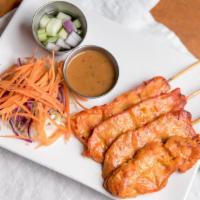 Chicken Satay (4) · Grilled marinated chicken on skewers. Served with peanut sauce. Https://cdn. Doordash. Com/s...