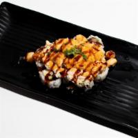 Baked Scallop Roll · Spicy mayo baked scallop with crab mix on top of California roll with eel sauce and scallion