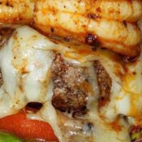 Surf 'N Turf Burger · I handcrafted burger with grilled shrimp and and onion rings with for Cheese on a grilled bu...