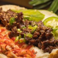 Spicy Beef Short Rib · Foodie favorite. Kimchee, oiled scallions, cucumber, cilantro, jalapeños, sriracha, and chil...