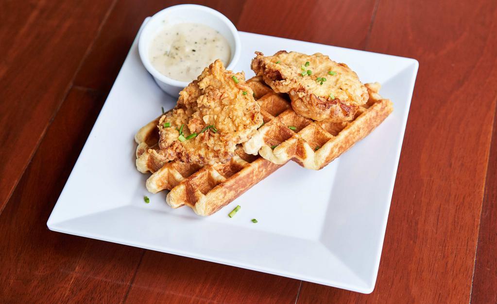 Fried Chicken & Waffles · Two buttermilk fried chicken breast on two Portland style waffles with the choice of our house made country herb gravy or organic maple syrup.