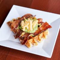 Spicy Bacon Cheddar Jalapeno Waffle · Thick cut pepper bacon, Tillamook Cheddar and fresh jalapeño topped with house avocado-tomat...
