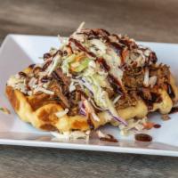 Pulled Pork Waffle · House Smoked Pulled Pork, Coleslaw, and Blackberry Ancho Ketchup on a Liege waffle.