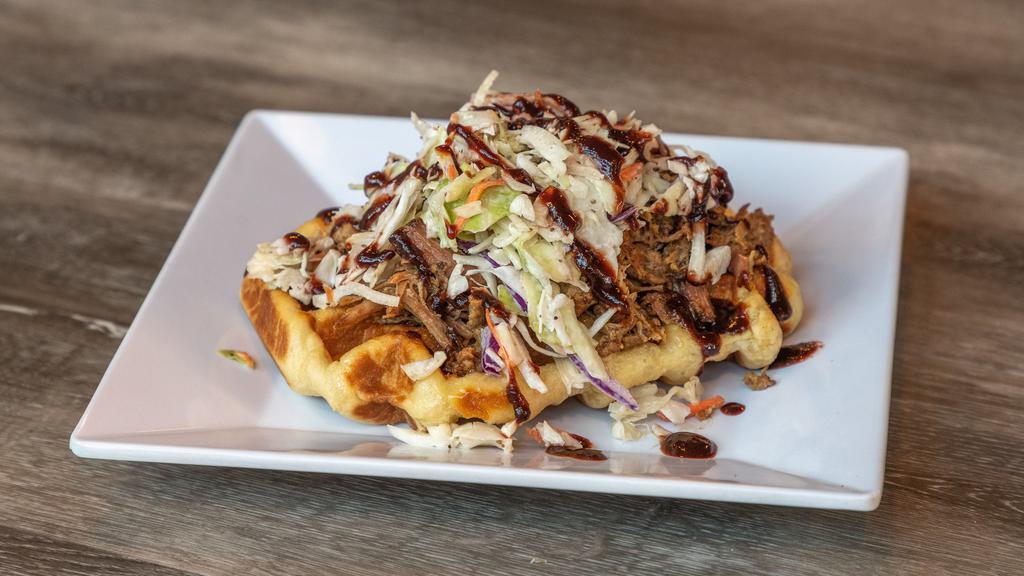 Pulled Pork Waffle · House Smoked Pulled Pork, Coleslaw, and Blackberry Ancho Ketchup on a Liege waffle.