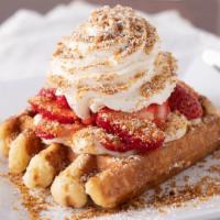 Strawberry Cheesecake Waffle · Fresh strawberries, our special cheesecake pudding, graham cracker crumb topping, and whippe...
