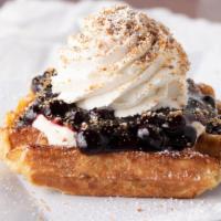 Blueberry Cheesecake Waffle · Blueberry Compote, our special cheesecake pudding, graham cracker crumb topping, and whipped...