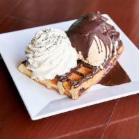 Darkest Desire Waffle · Max's salted caramel ice cream dark chocolate magic shell, whipped cream, and black lava salt.
