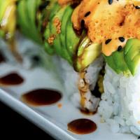 Dragon Cut Roll · Seaweed paper with sushi rice on outside, shrimp tempura, cucumber, sliced avocado, topped w...