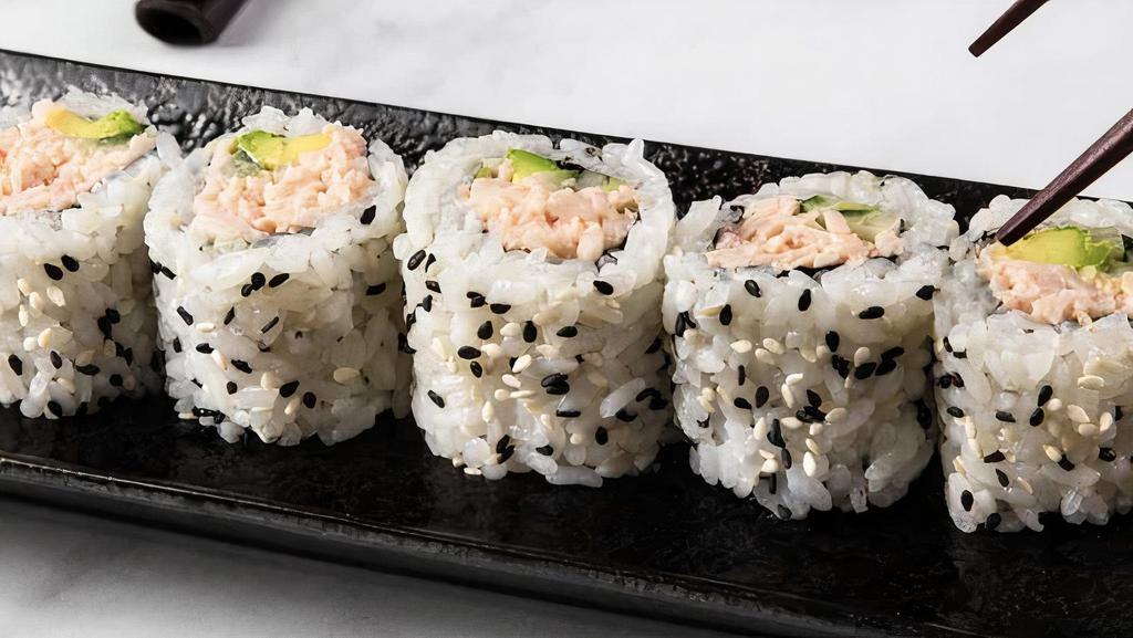 California Cut Roll · Seaweed paper with sushi rice on outside, filled with surimi crab, avocado and cucumber topped with furikake. Comes with fresh ginger, wasabi, soy sauce and chopsticks.