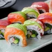 Rainbow Cut Roll · Seaweed paper with sushi rice on outside. Filled with surimi crab, cucumber, and avocado. Co...