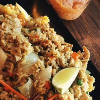 Pineapple Fried Rice · Choice of meat with curry powder, egg, tomatoes, carrot, pea, pineapple, onions, and cashew ...