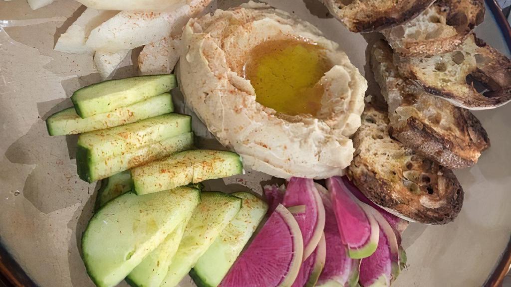 Tepary Bean Hummus Toast · Tepary bean hummus, cucumber slices, drizzled with olive oil and made with love.