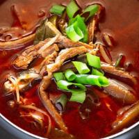 Yukgaejang · Spicy beef soup, sliced beef, scallions.