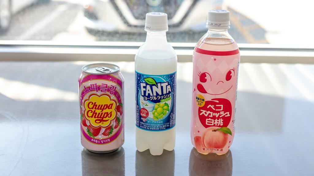 Soda · All those snacks are going to make you thirsty. We only choose the coolest, international sodas to send!