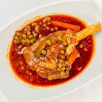 Lamb Shank Plate · Fresh, tender lamb shank cooked in a garlic tomato sauce, blend of spices and a mix of veget...