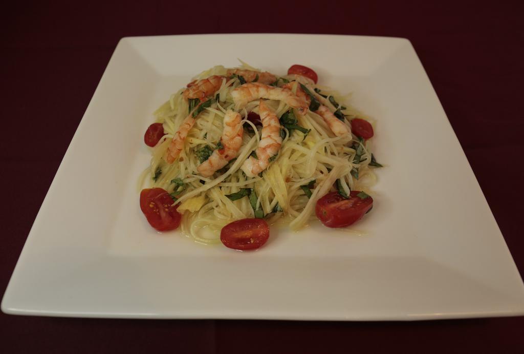 Papaya Salad With Grilled Shrimp · Served with fresh lime juice, mint, fish sauce, chili, onion, and peanut.