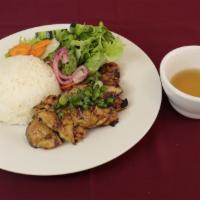 Rice With Grilled Pork · Grilled pork served with white rice, lettuce, cucumber and pickle carrots, daikon.