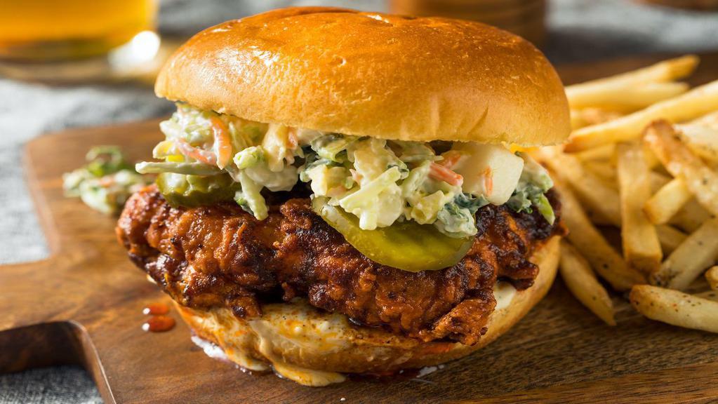 Nashville Hot Chicken Sandwich Combo · Hand breaded chicken dipped in our special Nashville hot sauce topped with ranch, coleslaw and pickles on a toasted brioche bun. Served with your choice of side, drink and dipping sauce.