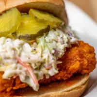 Nashville Hot Chicken Sandwich · Hand breaded chicken dipped in our special Nashville hot sauce topped with ranch, coleslaw a...