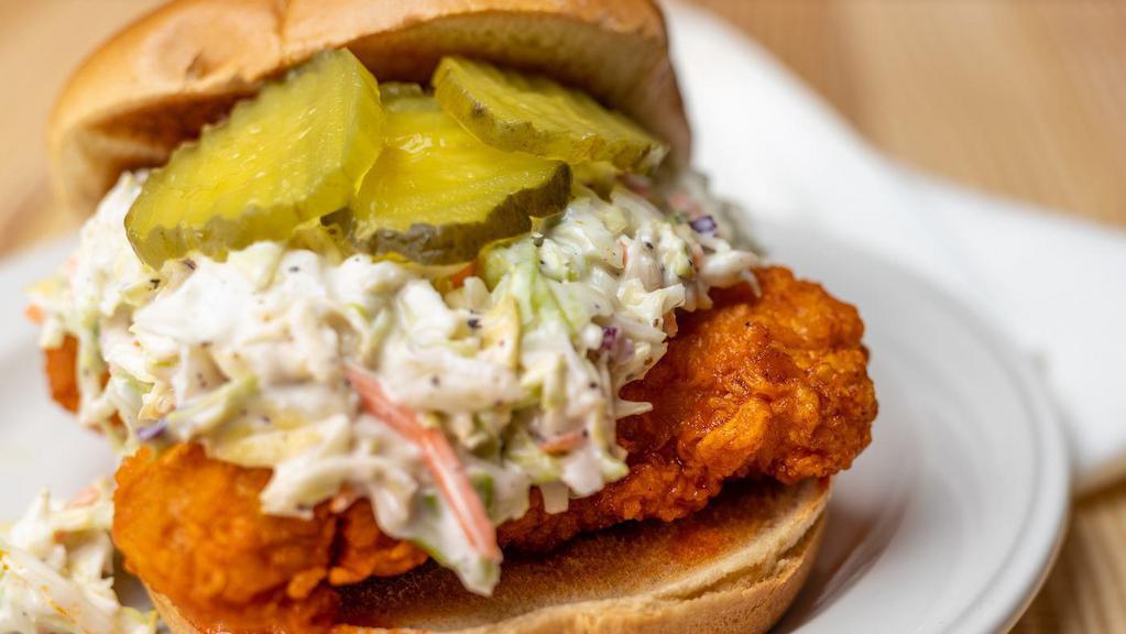 Nashville Hot Chicken Sandwich · Hand breaded chicken dipped in our special Nashville hot sauce topped with ranch, coleslaw and pickles on a toasted brioche bun.