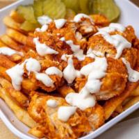 Nashville Hot Fries · French fries topped with chicken tenders, Nashville hot sauce and pickles.