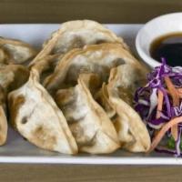 Pot Stickers · Chicken vegetable Japanese pot stickers with ginger & sweet black soy sauce.