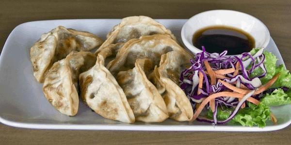 Pot Stickers · Chicken vegetable Japanese pot stickers with ginger & sweet black soy sauce.