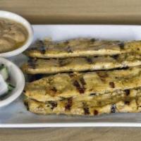 Chicken Satay · This street food favorite features marinated chicken flame-grilled on bamboo skewers. Served...