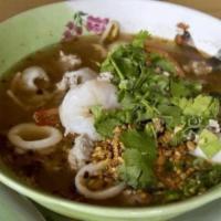 Kuay Teaw Tom Yum · (Hot and Sour Noodle Soup)This main course soup features rice noodles with shrimp, squid, BB...