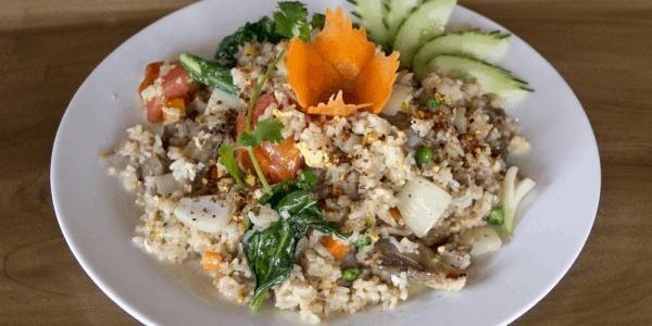 Khao Pad · (Thai Fried Rice) Wok-fried jasmine rice, onions, tomatoes, peas, carrots, Chinese broccoli, and egg.