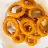 Large Onion Ring · Put a ring on it with our gourmet, lightly breaded onion rings.