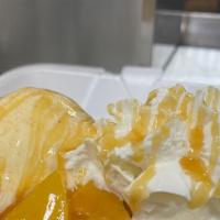 Peach Cobbler  Nachos · Homemade Cinnamon Sugar Chips topped with Peach Cobbler Filling, Ice Cream, Whipped Cream, a...