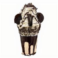 Cookies N' Cream · Frosting covered cup dipped in oreo cookies, cookie filled ice cream, topped with oreos and ...