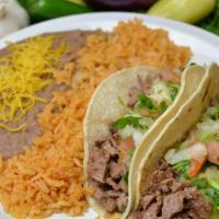 #12. 2 Carne Asada Tacos · Steak, Guacamole and Pico de Gallo. Rice, Beans and Cheese Included