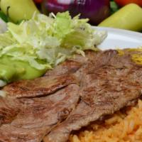 #15. Carne Asada Plate · Two slabs of steak, Pico and Guacamole, comes with Rice, Beans and Cheese