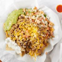 Super Nachos · Comes with chips, cheese, sour cream, guacamole, beans, pico, and carne asada. Any add on's ...
