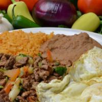 Steak Ranchero · Steak scrambled with pico de gallo and enchilada sauce topped with 2 over easy eggs. Flour t...