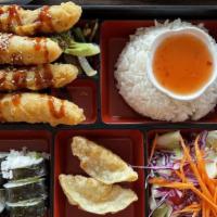 Shrimp Bento Box · Tempura shrimp (4), served w/rice, miso soup, house salad, gyoza (2), & California roll (4) ...