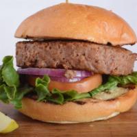 Vegetarian Classic Hamburger · Beyond burger patty on a brioche bun. Tomato, red onion, lettuce, and pickles.