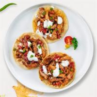 All About Al Pastor Taco · Thinly sliced boneless shoulder pork topped with sour cream, salsa, chilies, and cilantro se...