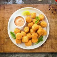 Just Tot · (Vegetarian) Shredded Idaho potatoes formed into tots, battered, and fried until golden brow...