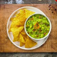 Guacamole & Chips · A heaping scoop of fresh guacamole and warm tortilla chips