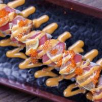 Executive Roll · Shrimp tempura, avocado, cilantro topped with tuna, lime, spicy mayo, and tobiko