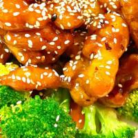 Sesame Chicken · Hot & spicy. Crispy chicken nuggets tossed in sweet and spicy sesame sauce. Served on a bed ...