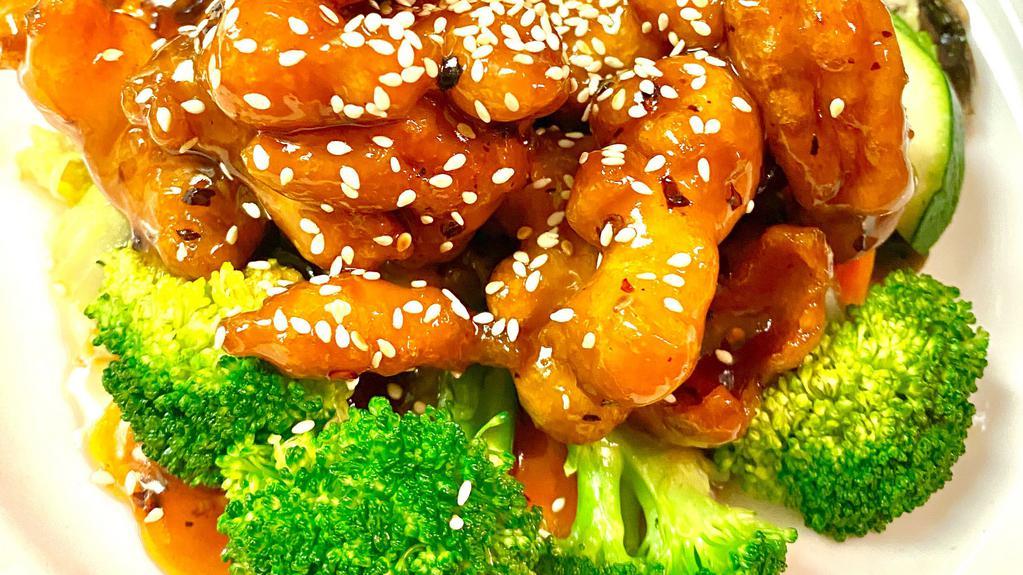 Sesame Chicken · Hot & spicy. Crispy chicken nuggets tossed in sweet and spicy sesame sauce. Served on a bed of steamed vegetables.