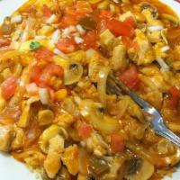 Arroz Con Pollo · Served on a bed of rice and cheese. Sautéed in our own special sauce with onions, mushrooms,...