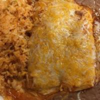 Enchiladas Tradicionales · Two enchiladas with choice of cheese, shredded chicken, ground beef or shredded beef.